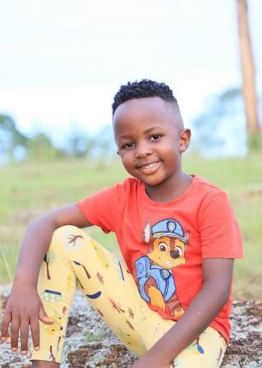 Prince smiling outdoors